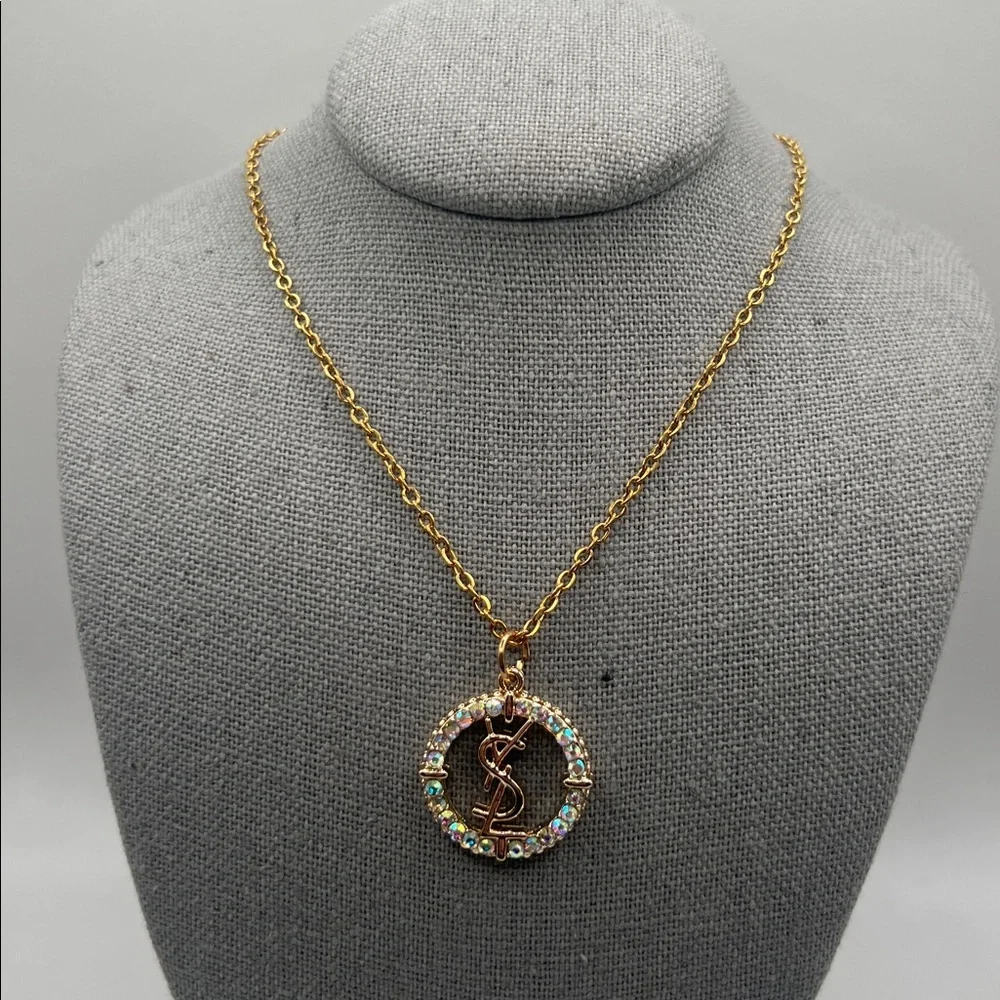 868. Elegant Gold YSL Pendant on 18” gold plated chain. - Picture 2 of 8